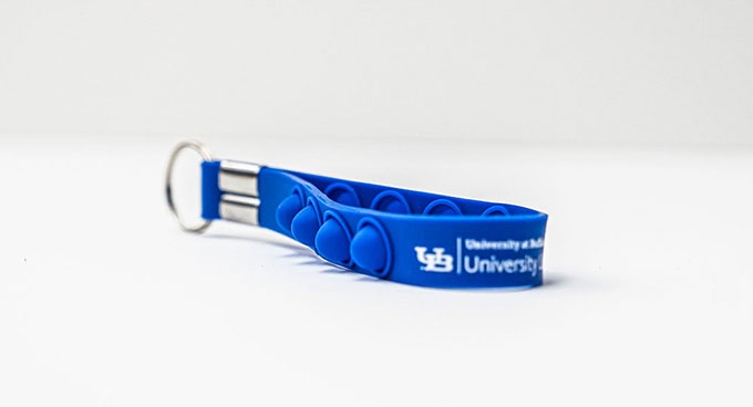 Picture of the Push Pop Fidget Strap Keychain. 