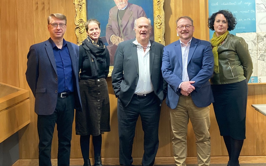 (From left) Scott Hollander, Alison Fraser, Colm Tóibín, James Maynard, and Barbara Cole stand before a portrait of James Joyce’s father by Patrick Tuohy. 