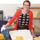 Elliot McNally with poetry magazine archives. 