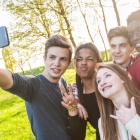 Diverse group of young people posing for a selfie. 