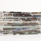 Photo of a stack of newspapers. 