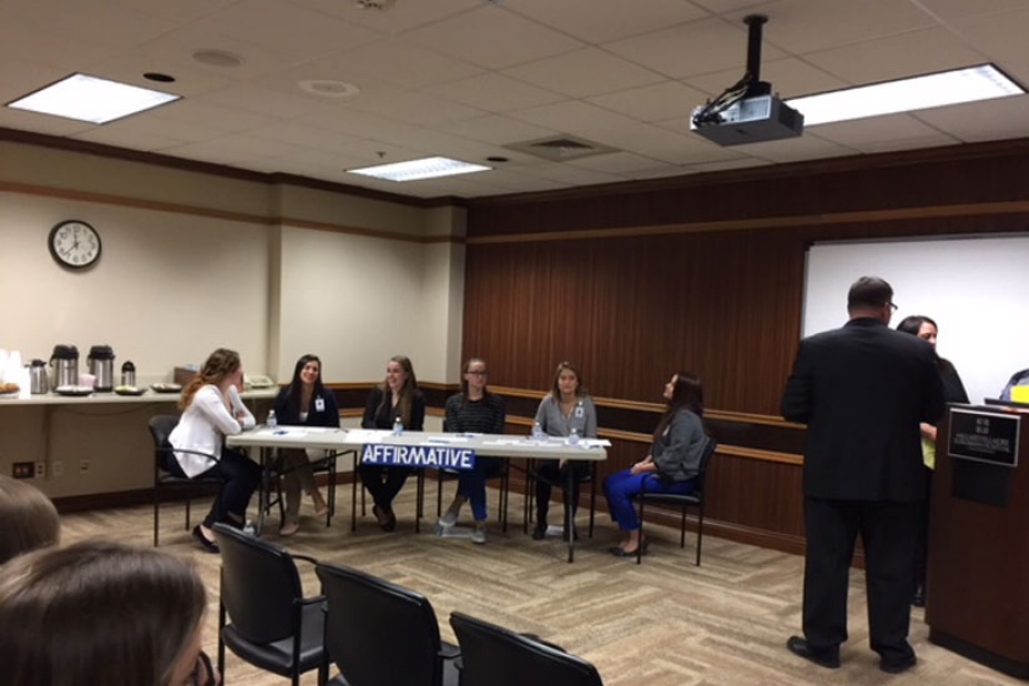 Photo of a debate team in the Buffalo General Medical Center. 