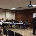 Photo of a debate team in the Buffalo General Medical Center. 
