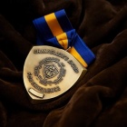 SUNY Chancellor’s Award medal. 