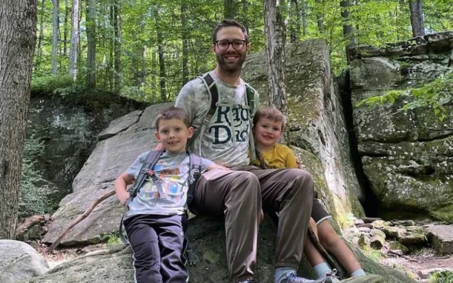 Justin Dise with his kids in the woods. 