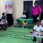 Cynthia with Owo Smart Green School children and Chizoba Onyebara. 