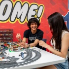 two students in the LEGO area. 