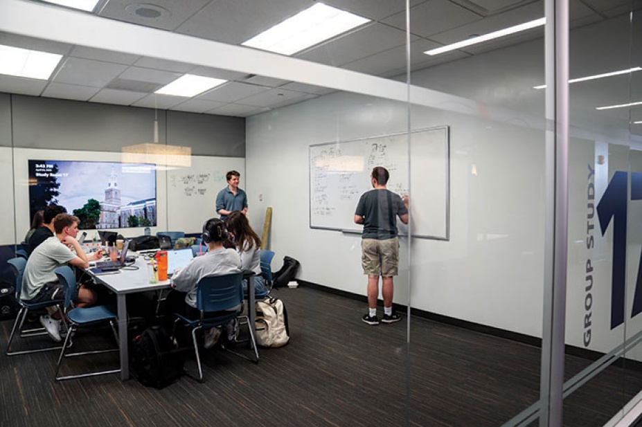 Engineering students prepare for finals in a group study room. 