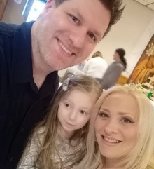 Nick pictured with his wife and daughter. 
