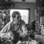 Robert Creeley sitting in the kitchen. 