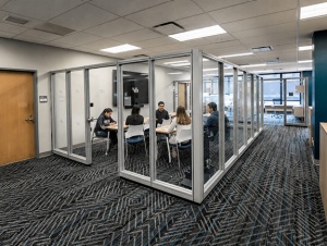 People collaborating in the 201D studio space. 