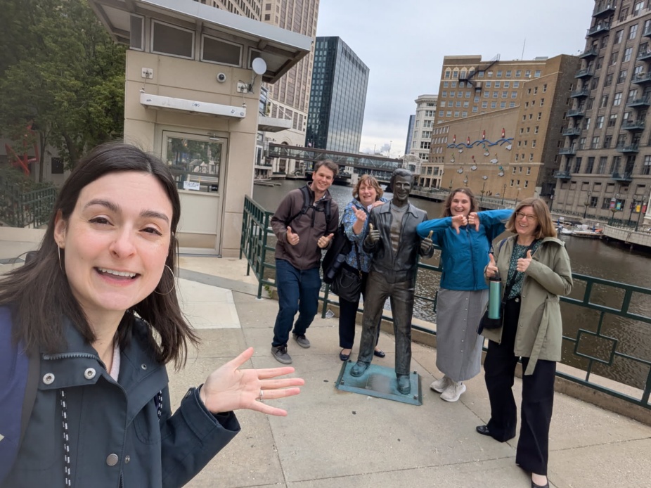 Group of librarians pose next to the Bronze Fonz statue.