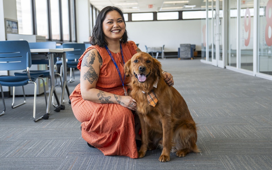Kae Savar and their therapy dog, Samwise. 