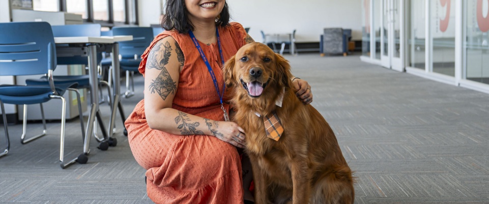 Kae Savar and their therapy dog, Samwise. 