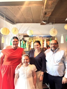 Marnie and her family celebrating her daughter's first communion together.