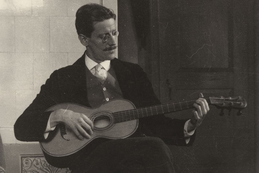 James Joyce plays guitar
